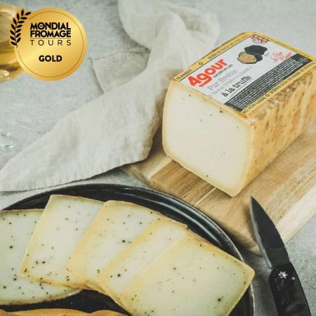 Brick of sheep cheese with...